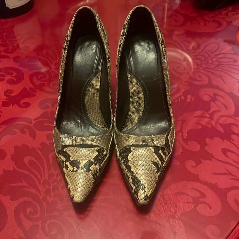 These are designer heels brand is unclear. Used. Beautiful sexy snake print